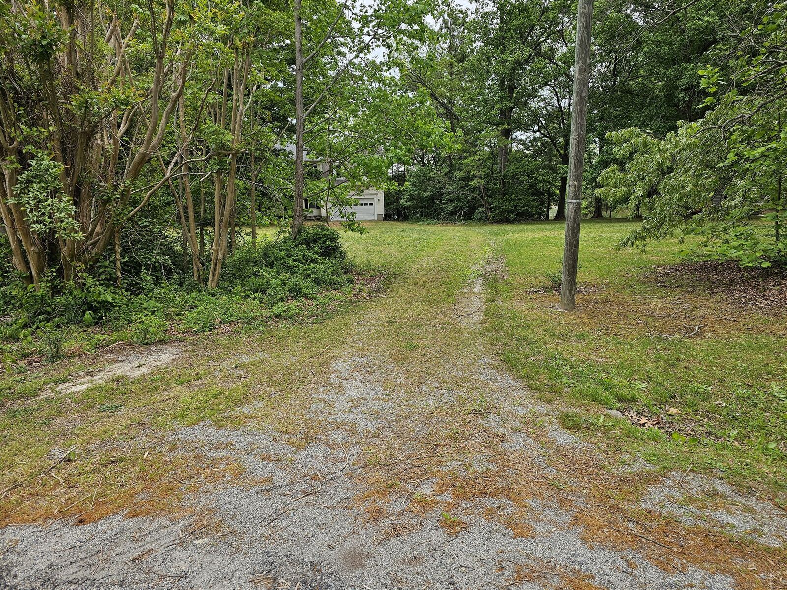 Driveway before regrading and gravel installation on a Virginia property