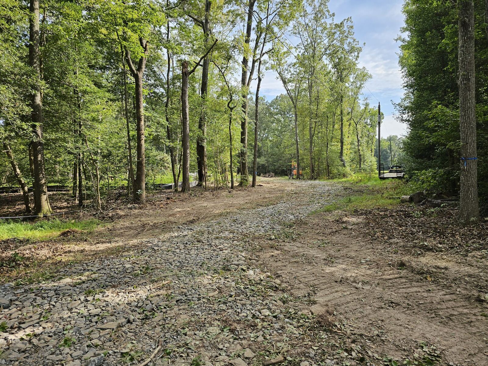 Long gravel driveway installation through wooded property in the Northern Neck of Virginia
