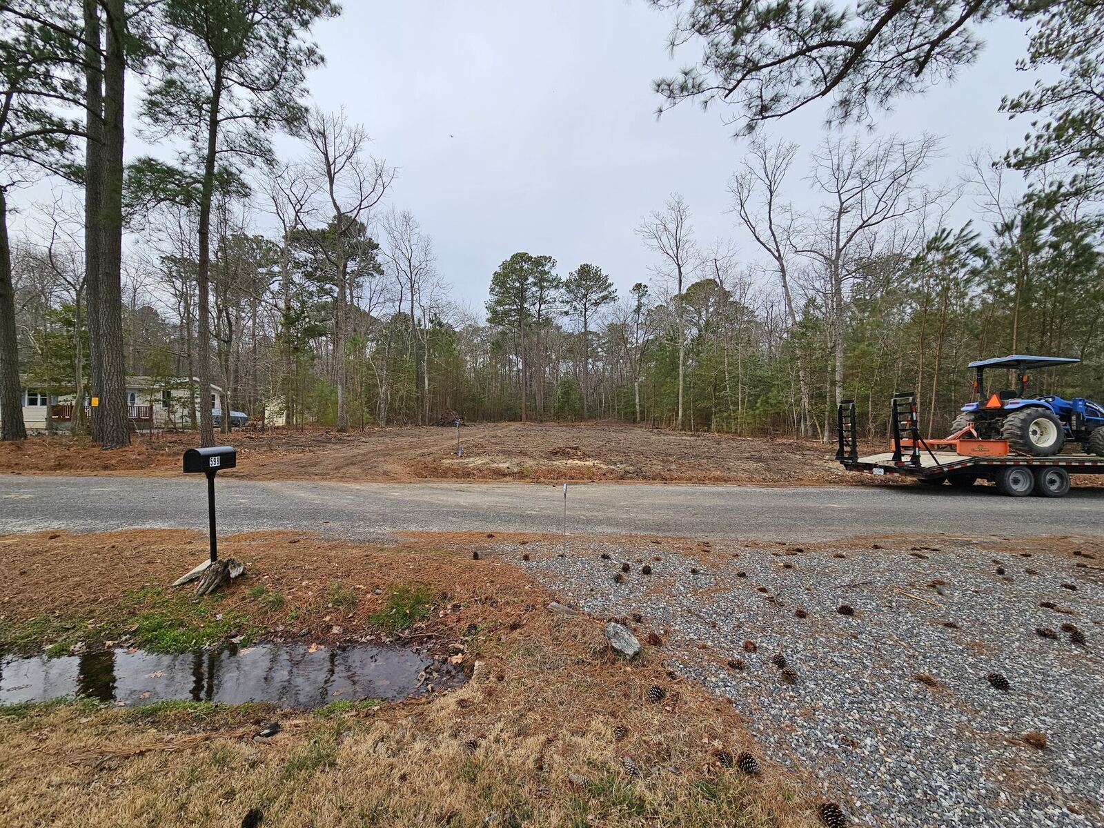 Long rural gravel driveway through the Northern Neck of Virginia